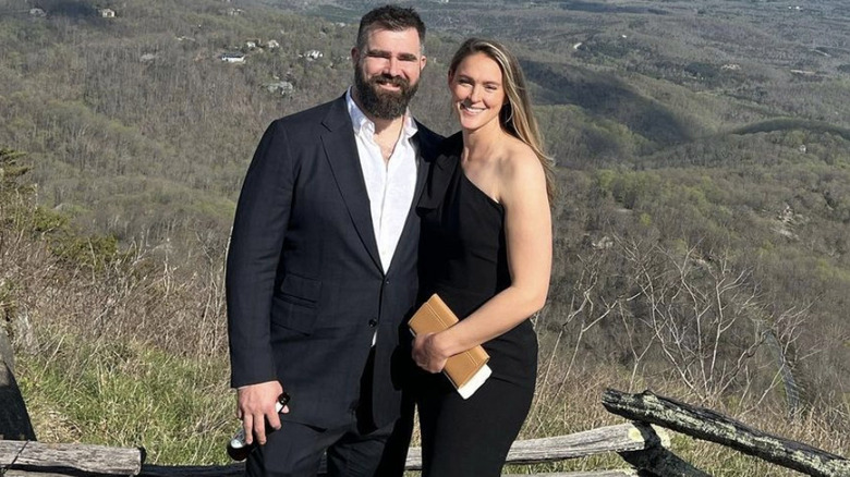 Jason and Kylie Kelce pose in front of mountains