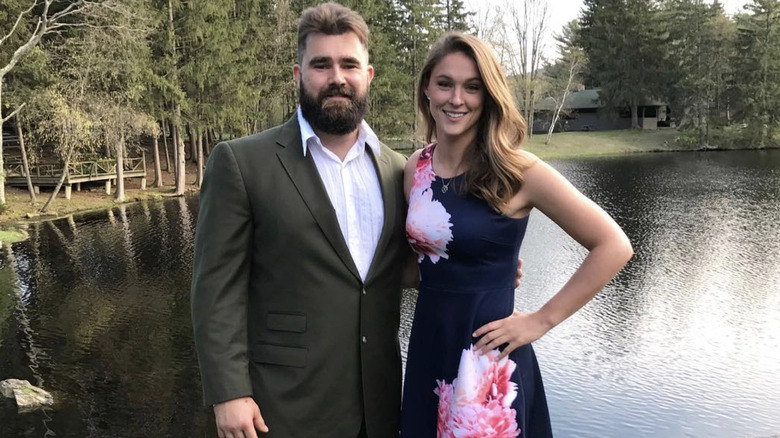 Jason and Kylie Kelse posing in front of a lake