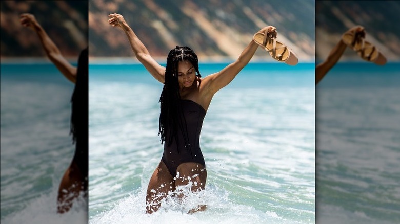 Woman playing in the ocean