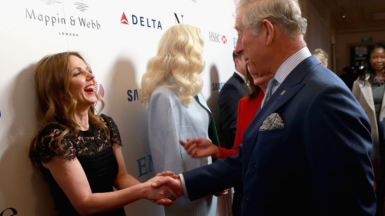 King Charles shaking Geri Halliwell's hand