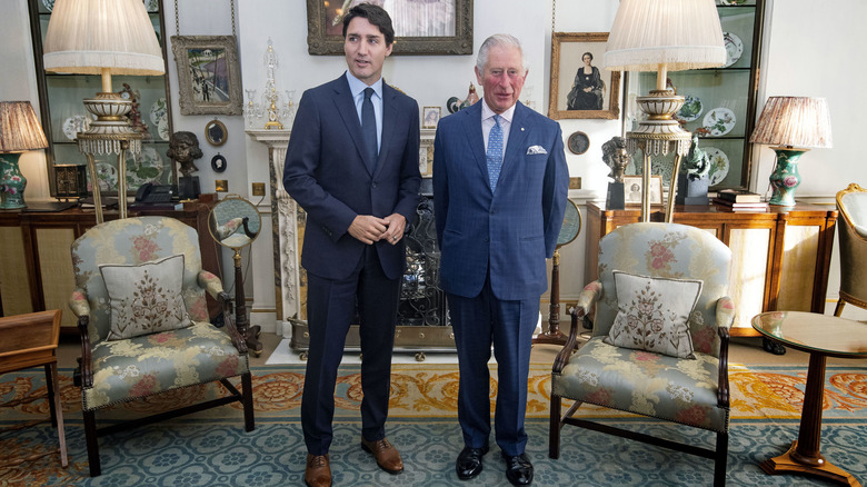 King Charles and Justin Trudeau standing together
