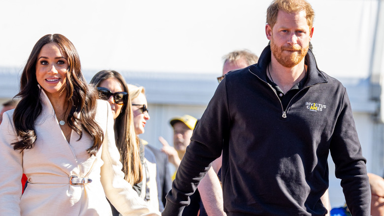 Meghan Markle and Prince Harry holding hands