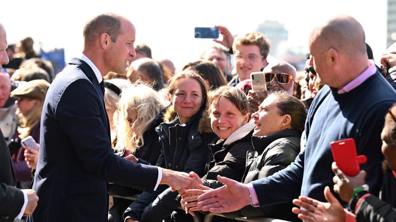 Prince William greets mourners