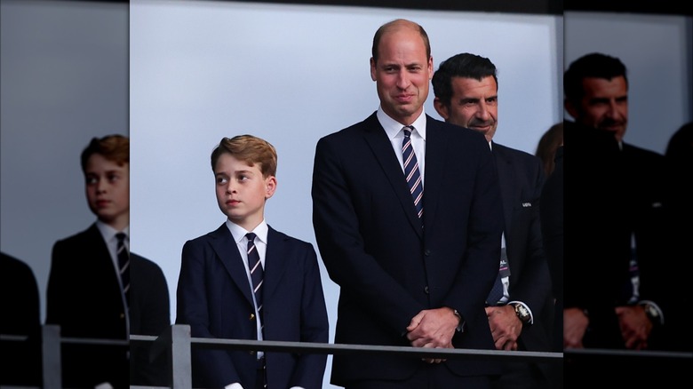 Prince George and Prince William standing together