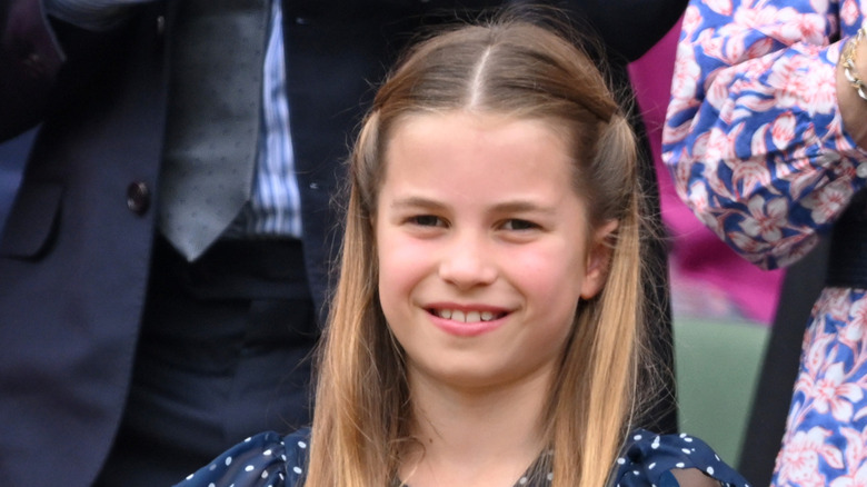 Princess Charlotte smiling at a sporting event