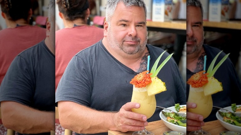 Big Ed with a yellow drink