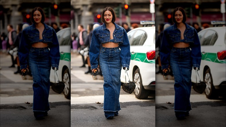 Woman wearing long denim skirt