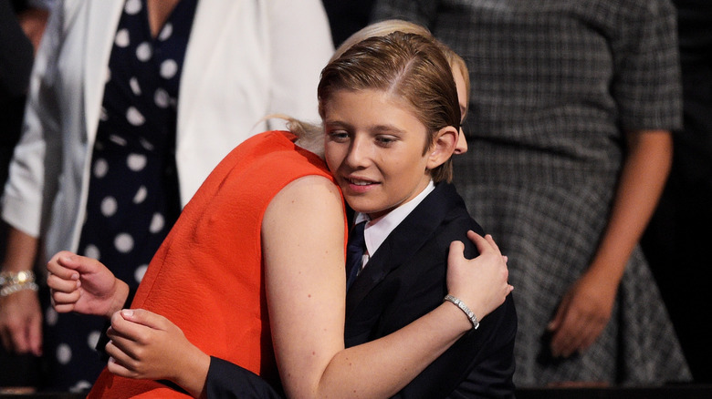 Tiffany Trump hugs a young Barron Trump