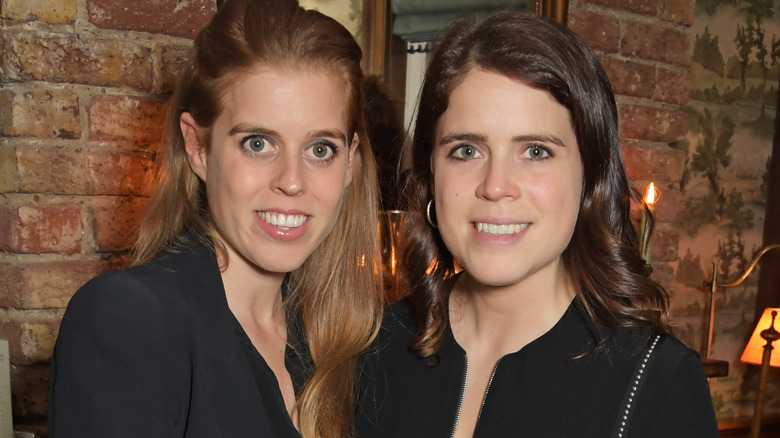 Princess Beatrice & Princess Eugenie smiling for photo