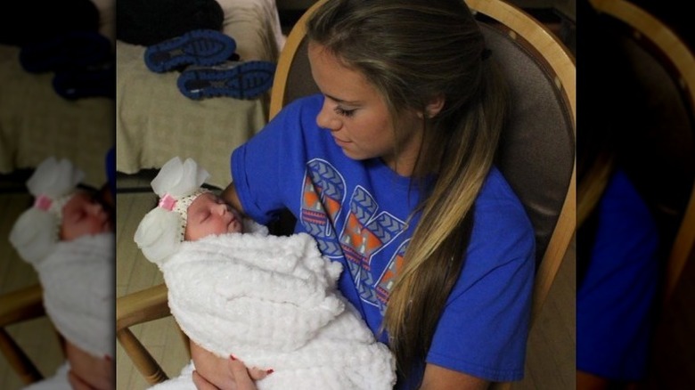 Baylee holding baby Ace 