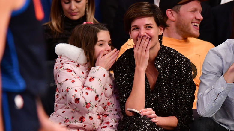 Katie Holmes and Suri Cruise laughing together