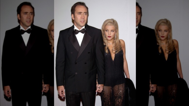 Nicolas Cage and Lisa Marie Presley holding hands