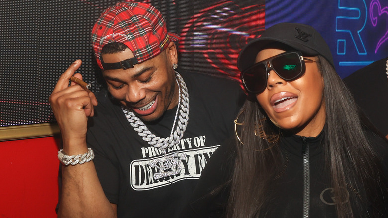 Ashanti and Nelly laughing