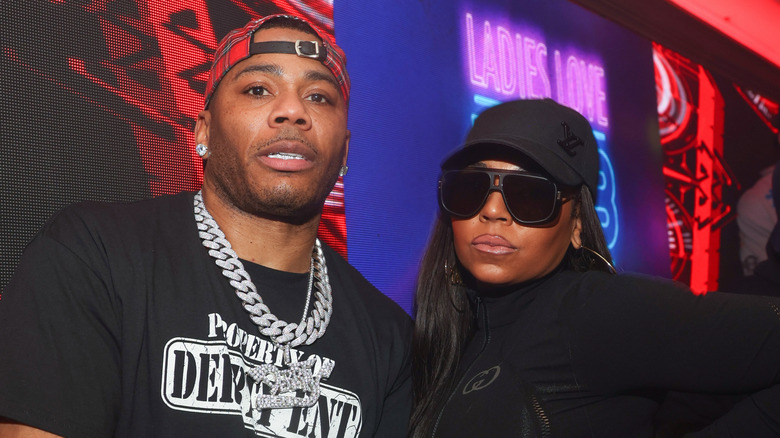 Nelly and Ashanti posing together