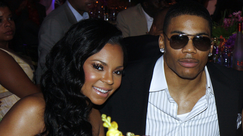 Ashanti and Nelly posing