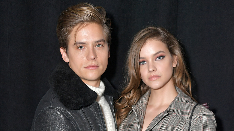 Dylan Sprouse and Barbara Palvin black background