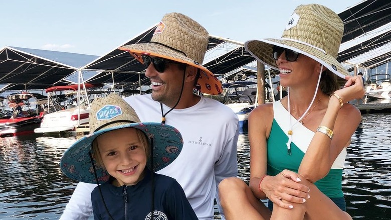 The Rancic family smiling on a boat