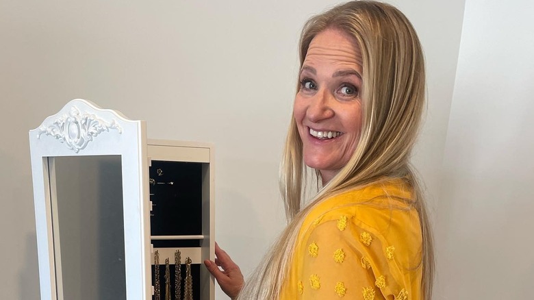 Christine Brown poses with jewelry 