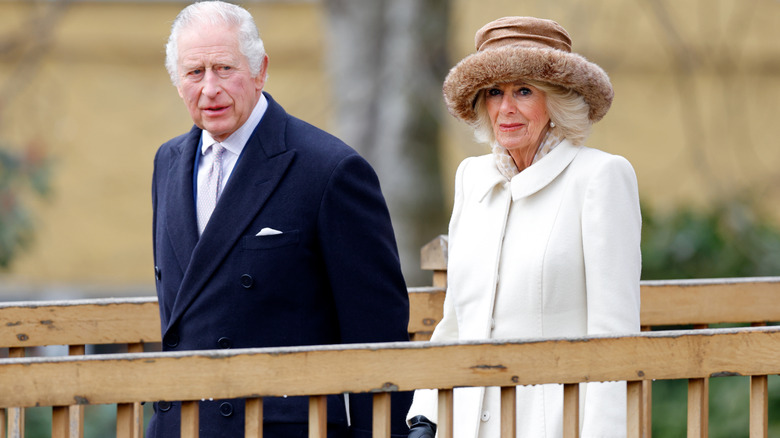 King Charles III and Queen Camilla walking