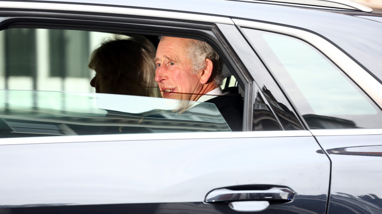 King Charles III driving with Queen Camilla