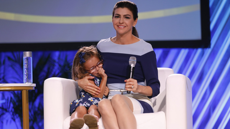 Casey DeSantis seated with her daughter Madison