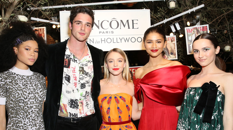 Zendaya in red dress with Jacob Elordi 