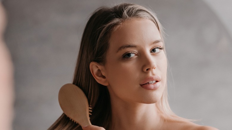 Woman brushing hair