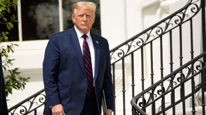 Donald Trump standing on stairs