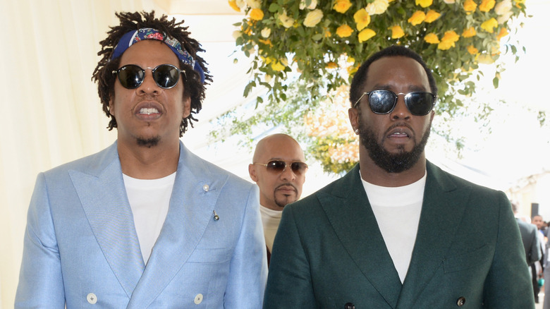 P Diddy and Jay-Z wearing sunglasses, posing together