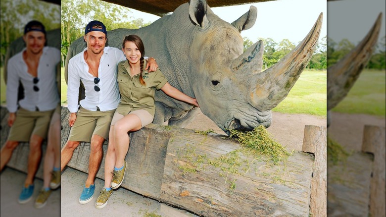 Derek Hough and Bindi Irwin with a rhino