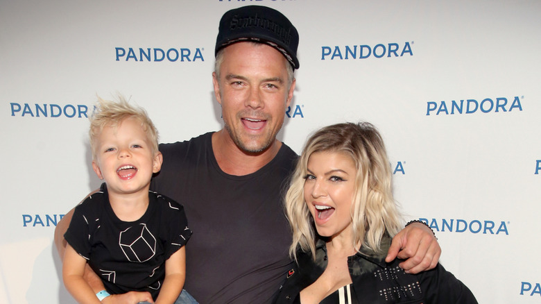 Josh Duhamel, Fergie, and son their son Axl smiling