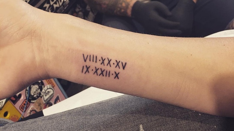 christina hall's children's birthdates tattooed on wrist