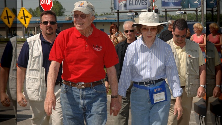 Jimmy and Rosalynn Carter holding hands