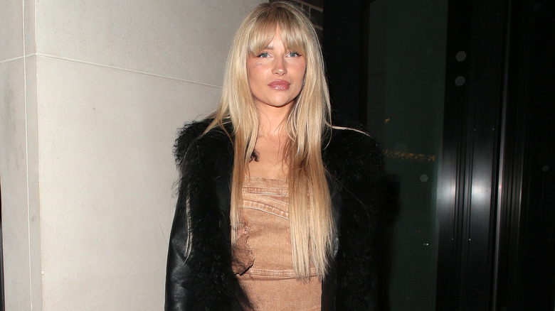 Lottie Moss posing outside at night