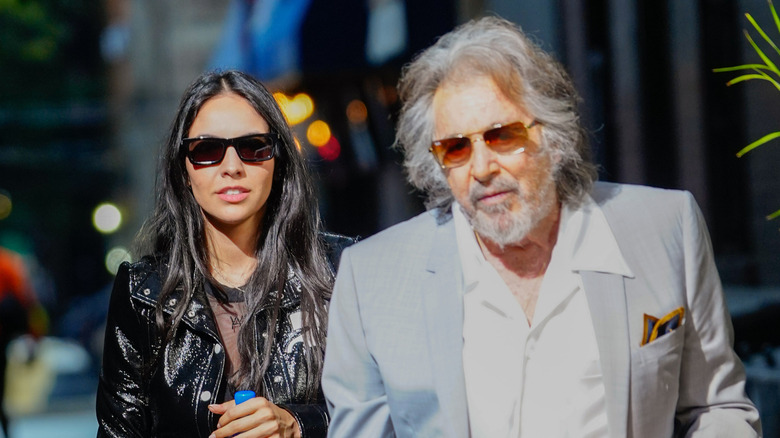 Noor Alfallah walking behind Al Pacino