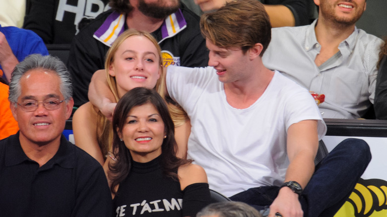 Taylor Burns and Patrick Schwarzenegger at a Lakers game in January 2014