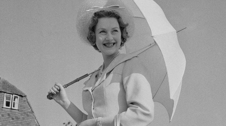 Raine Spencer poses with umbrella