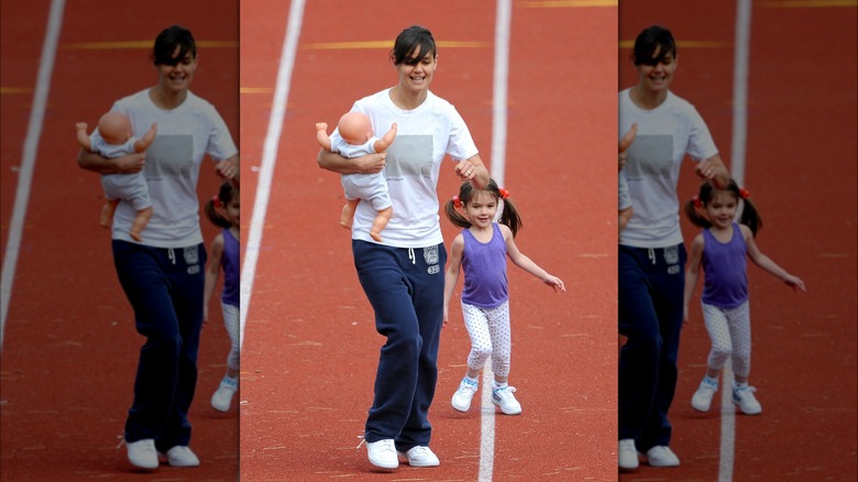 Katie Holmes running with daughter Suri 