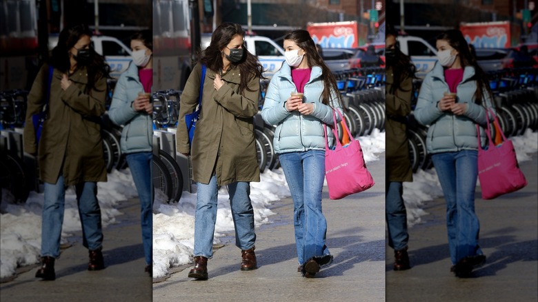 Katie Holmes and Suri Cruise walk together wearing face masks