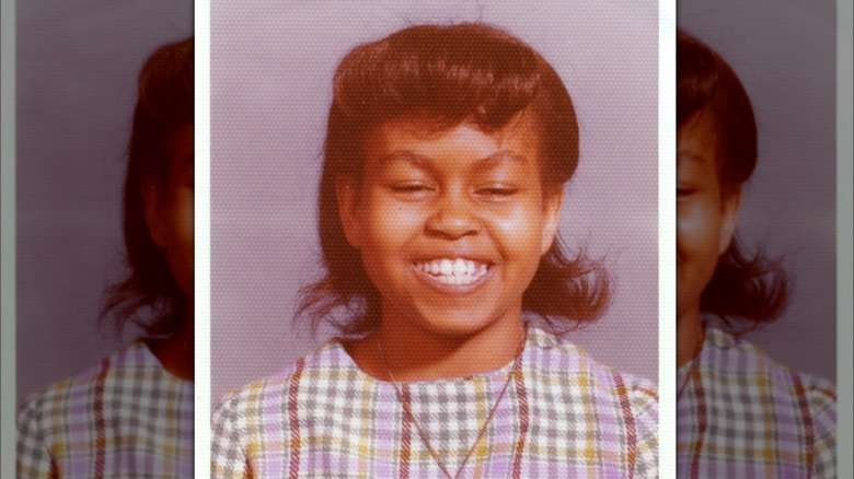 Michelle Obama smiling in a school picture