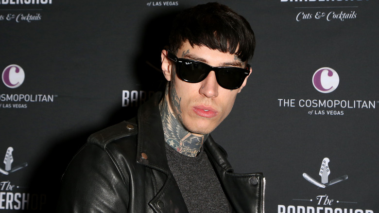 Trace Cyrus posing at event