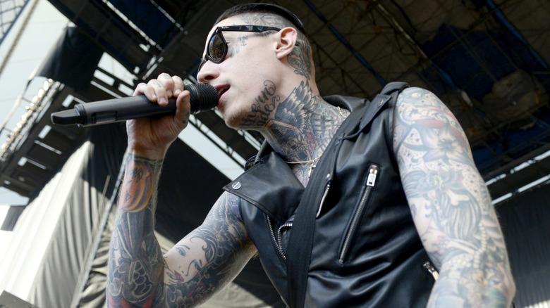 Trace Cyrus singing at concert