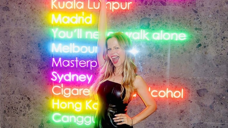 Tammin Sursok posing neon signs