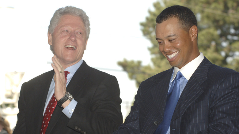 Bill Clinton and Tiger Woods laughing