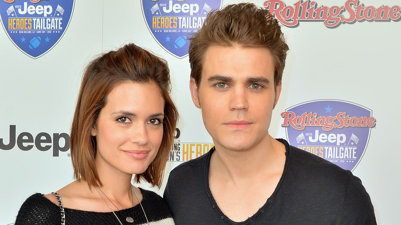 Paul Wesley and Torrey DeVitto posing