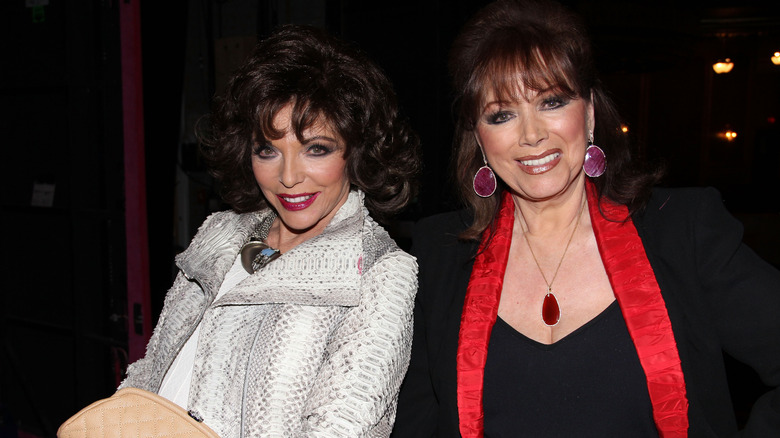 Joan Collins and Jackie Collins smiling