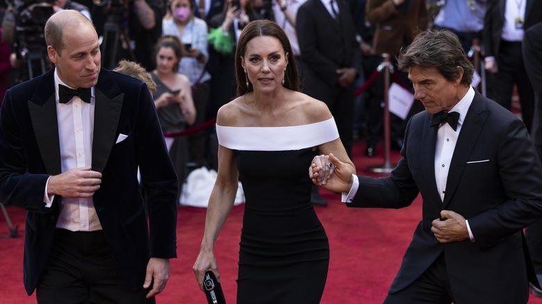 William, Kate and Tom Cruise walking together