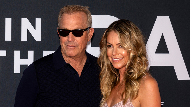 Christine Baumgartner smiling alongside Kevin Costner