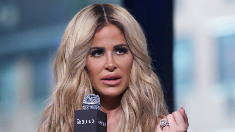 Kim Zolciak holding microphone