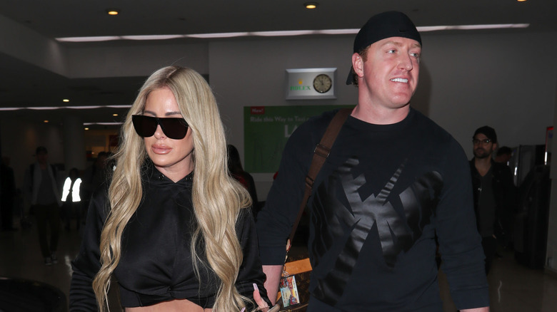 Kim Zolciak and Kroy Biermann walking